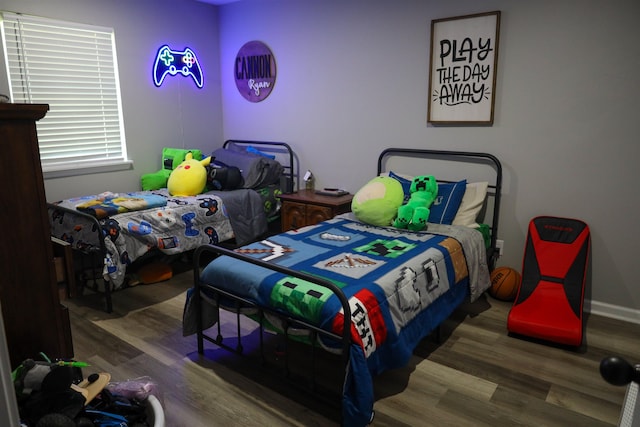 bedroom with wood finished floors