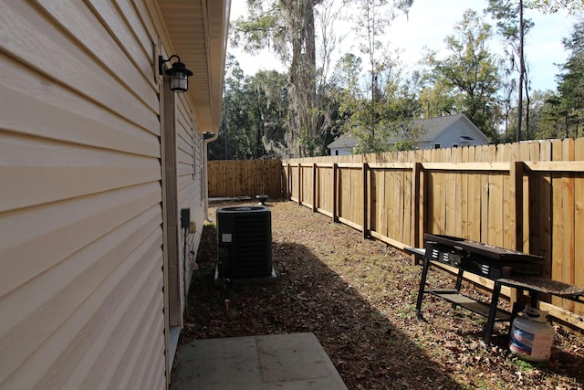 view of yard featuring central air condition unit