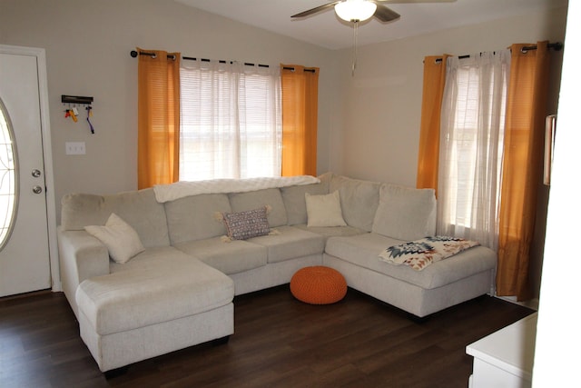 living room featuring dark hardwood / wood-style flooring, a wealth of natural light, and ceiling fan