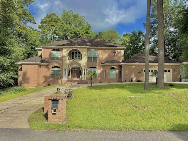 10 Yvonne Ct, Havana, FL 32333 - view of front of property with a front lawn, concrete driveway, and brick siding