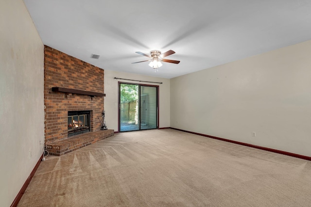 2398 Continental Ave, Tallahassee, FL 32304 - unfurnished living room with ceiling fan, carpet floors, and a brick fireplace