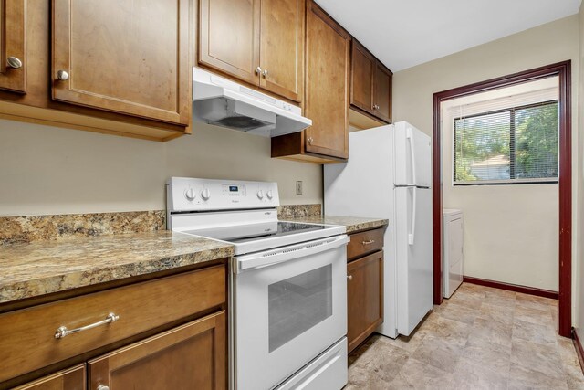 2398 Continental Ave, Tallahassee, FL 32304 - kitchen featuring white appliances, under cabinet range hood, light countertops, and brown cabinetry