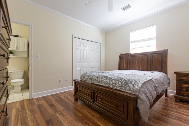 bedroom featuring ceiling fan, dark wood-type flooring, ensuite bathroom, a closet, and ornamental molding