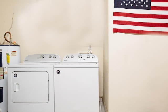 washroom featuring washer and dryer and water heater