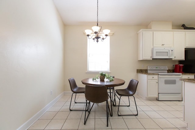 tiled dining space with a chandelier