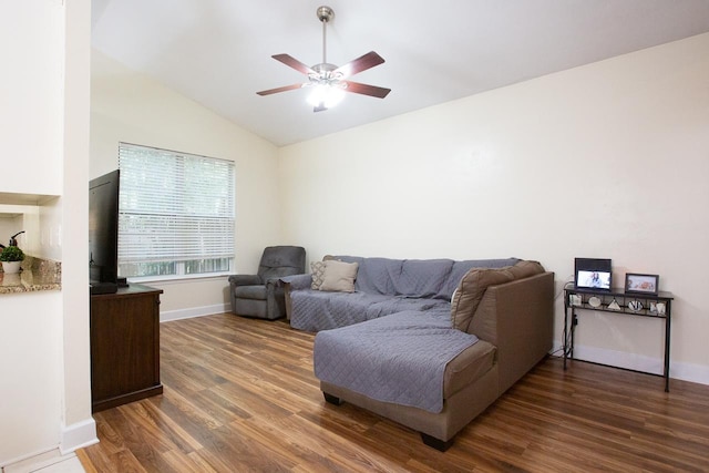 living room featuring lofted ceiling, ceiling fan, and dark hardwood / wood-style floors