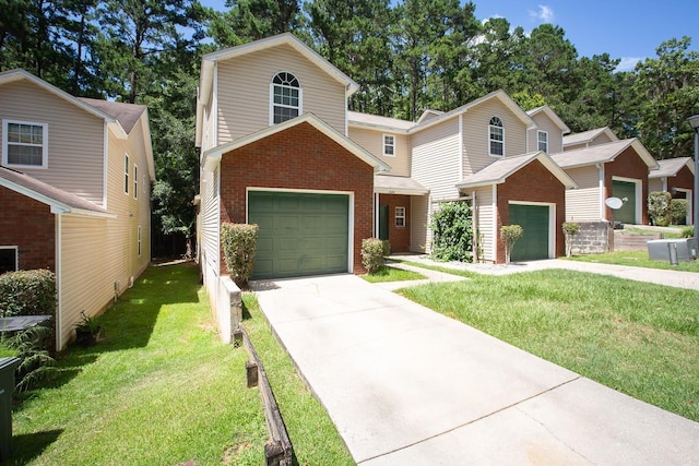 front of property featuring a front yard and a garage