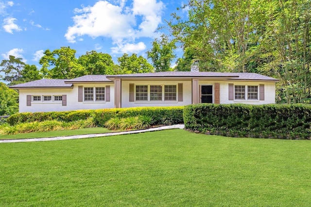 1102 Betton Rd, Tallahassee, FL 32308 - ranch-style home with a front lawn, a chimney, and stucco siding