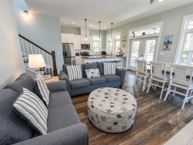 living room featuring recessed lighting, stairway, dark wood-type flooring, and french doors