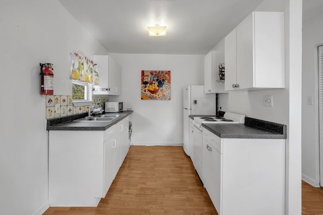 kitchen with sink, white cabinets, white appliances, and light wood-type flooring