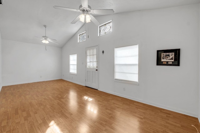 foyer featuring light hardwood / wood-style flooring, high vaulted ceiling, and ceiling fan