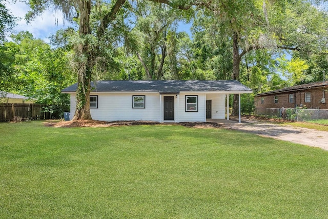 3204 N Ridge Rd, Tallahassee, FL 32305 - ranch-style house featuring concrete driveway and a carport