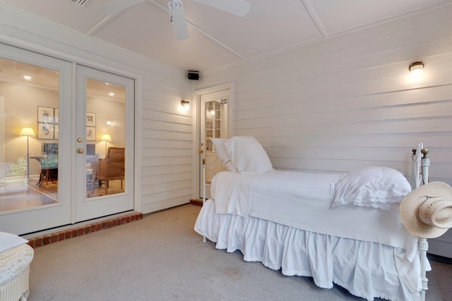 bedroom featuring french doors, ceiling fan, and carpet