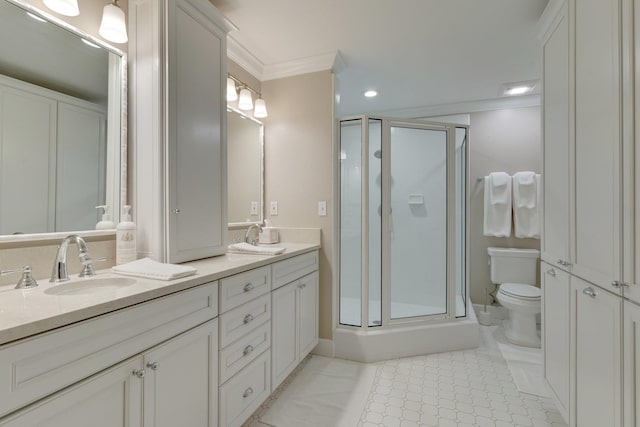 bathroom featuring toilet, a shower with shower door, crown molding, vanity, and tile patterned flooring