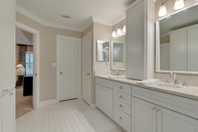 bathroom featuring ornamental molding and vanity