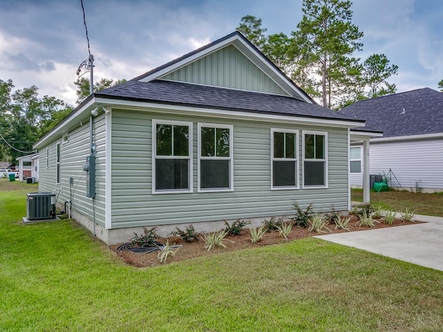 view of home's exterior featuring cooling unit, a yard, and a patio