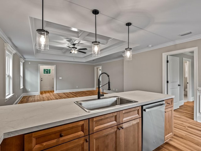 kitchen featuring sink, pendant lighting, dishwasher, and crown molding