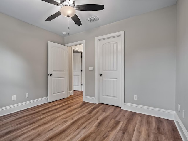 unfurnished bedroom featuring ceiling fan and light wood-type flooring