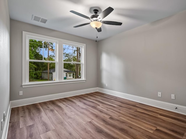 empty room featuring ceiling fan and light hardwood / wood-style flooring