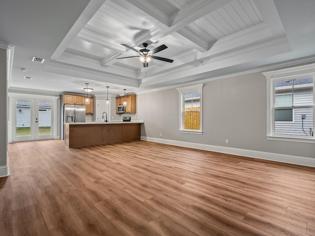 unfurnished living room with ceiling fan, sink, crown molding, and light hardwood / wood-style flooring