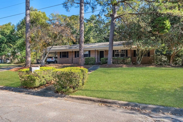 ranch-style home with a front yard