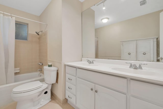 full bathroom featuring tile patterned floors, vanity, shower / tub combo, and toilet