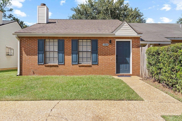 view of front of home with a front lawn