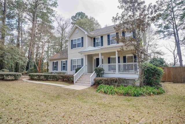 view of front of house with a porch and a front yard