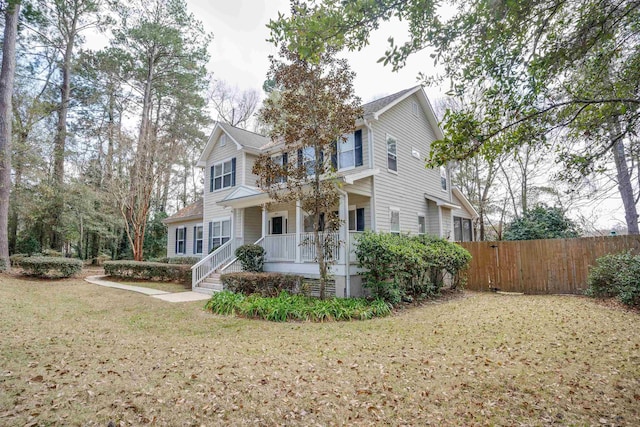 front of property with a front yard and a porch