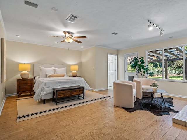 bedroom with ceiling fan, light hardwood / wood-style flooring, and crown molding