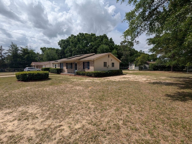 1106 Woodland Dr, Tallahassee, FL 32305 - single story home featuring a front lawn