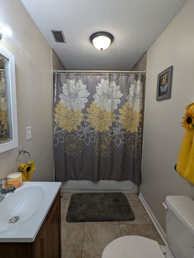 1106 Woodland Dr, Tallahassee, FL 32305 - full bathroom with toilet, a textured ceiling, visible vents, and shower / bath combo