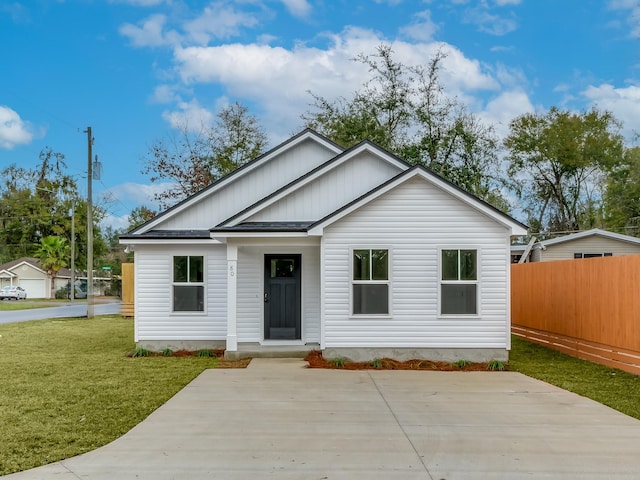 view of front of home with a garage and a front yard