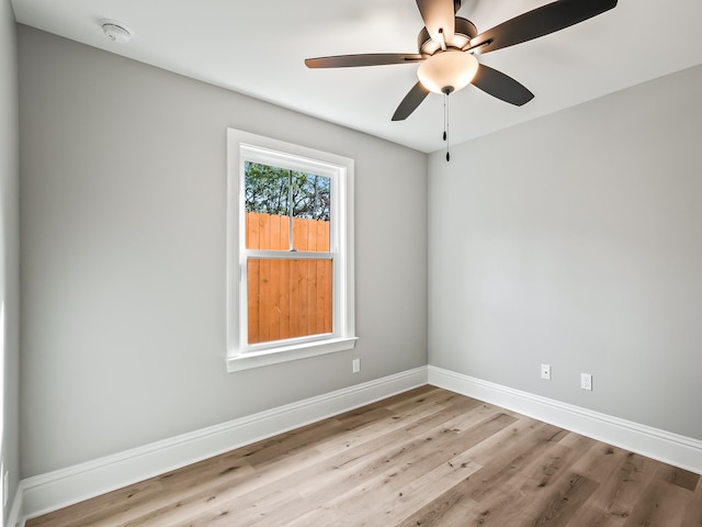 unfurnished room with light hardwood / wood-style flooring and ceiling fan