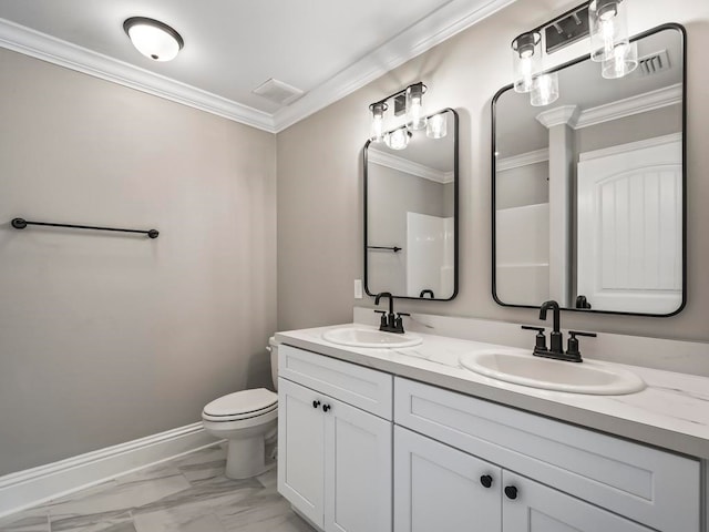 bathroom featuring vanity, toilet, and crown molding