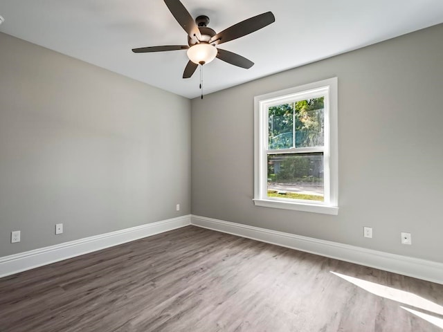 unfurnished room with hardwood / wood-style floors and ceiling fan