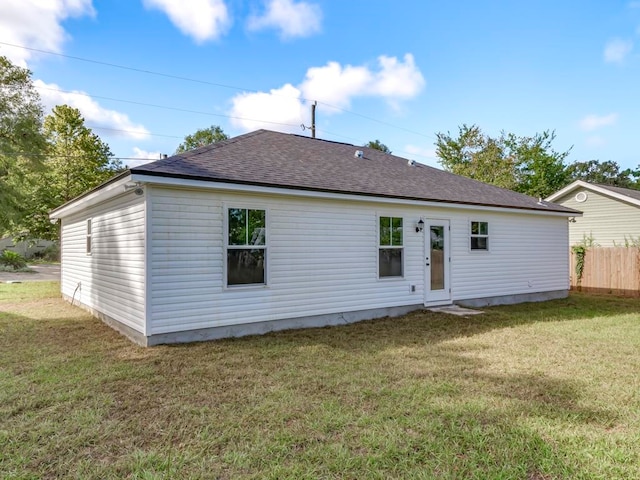 back of house featuring a yard