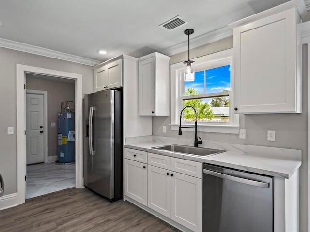 kitchen featuring stainless steel appliances, crown molding, water heater, sink, and white cabinetry