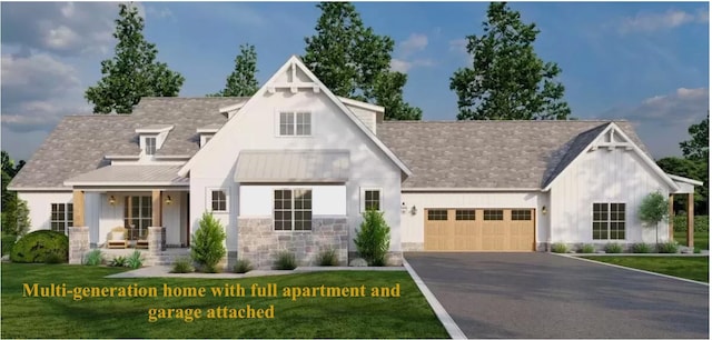 view of front of house with a garage and a front lawn