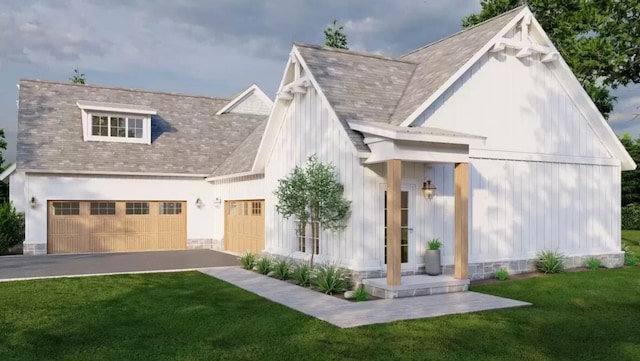 view of front of house with a front lawn and a garage