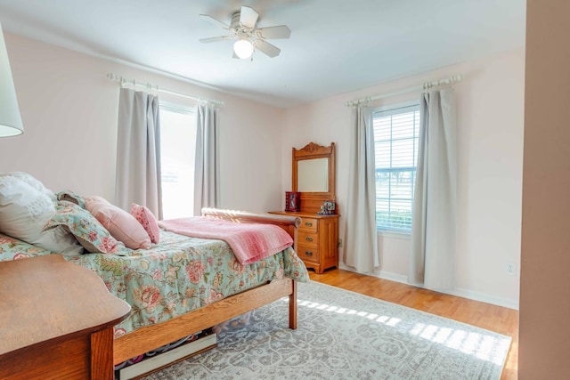 bedroom featuring light hardwood / wood-style floors and ceiling fan