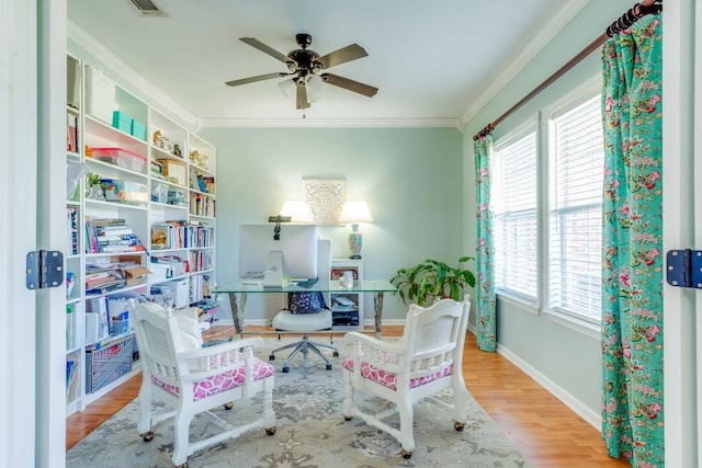 office area featuring ceiling fan, light hardwood / wood-style flooring, and ornamental molding