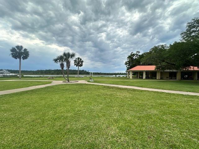 32 Pirates Cove Ln, Saint Marks, FL 32355 - view of community featuring a lawn
