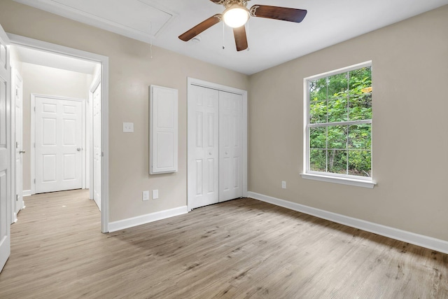 32 Pirates Cove Ln, Saint Marks, FL 32355 - unfurnished bedroom with attic access, light wood-type flooring, baseboards, and a closet