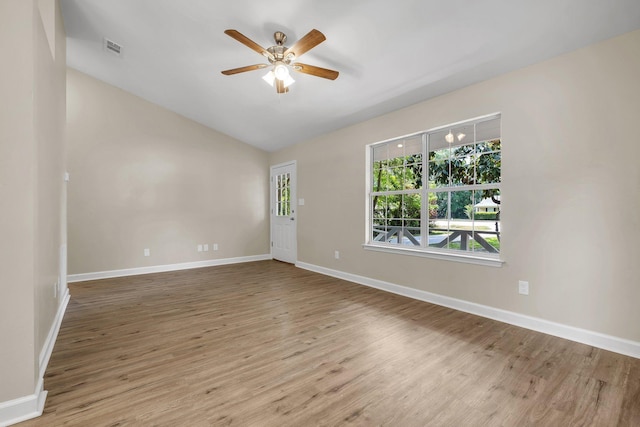 32 Pirates Cove Ln, Saint Marks, FL 32355 - empty room featuring wood finished floors, ceiling fan, baseboards, and lofted ceiling