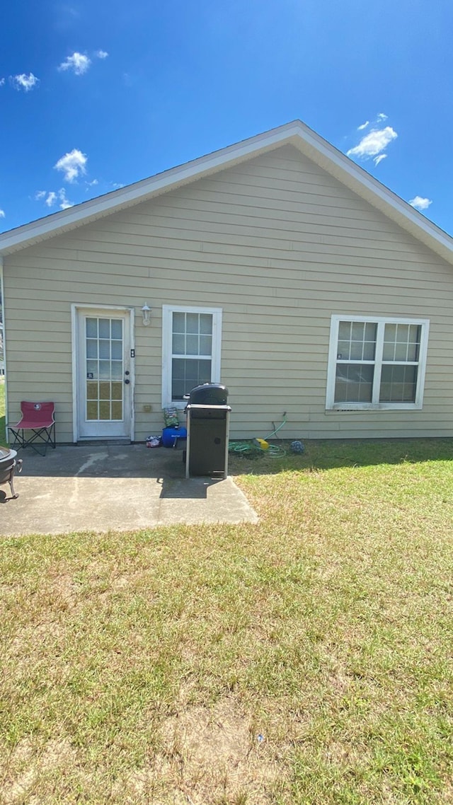 4170 Ridge Haven Rd, Tallahassee, FL 32305 - back of house with a yard and a patio
