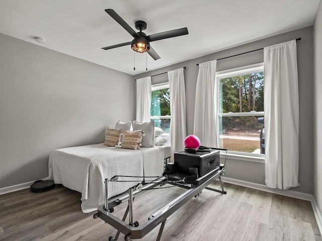 bedroom featuring ceiling fan and wood-type flooring