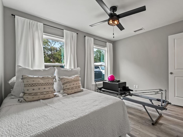 bedroom featuring ceiling fan and light hardwood / wood-style flooring