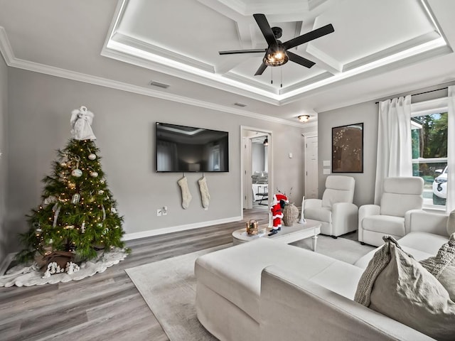 living room with hardwood / wood-style floors, ceiling fan, ornamental molding, and coffered ceiling