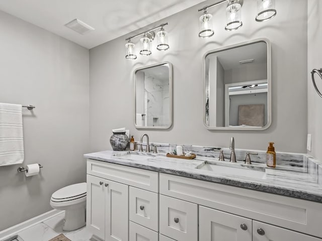 bathroom with vanity and toilet